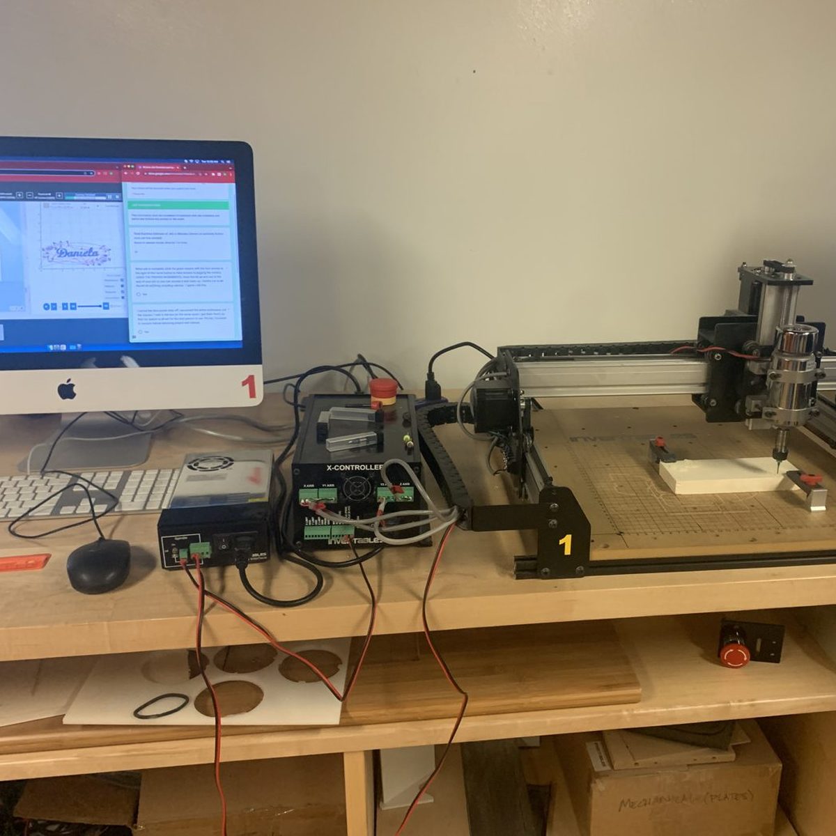 Makerspace workstation with the Easel design software open on the computer next to the carving machine